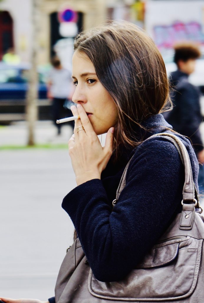 Beautiful woman smoking in Paris