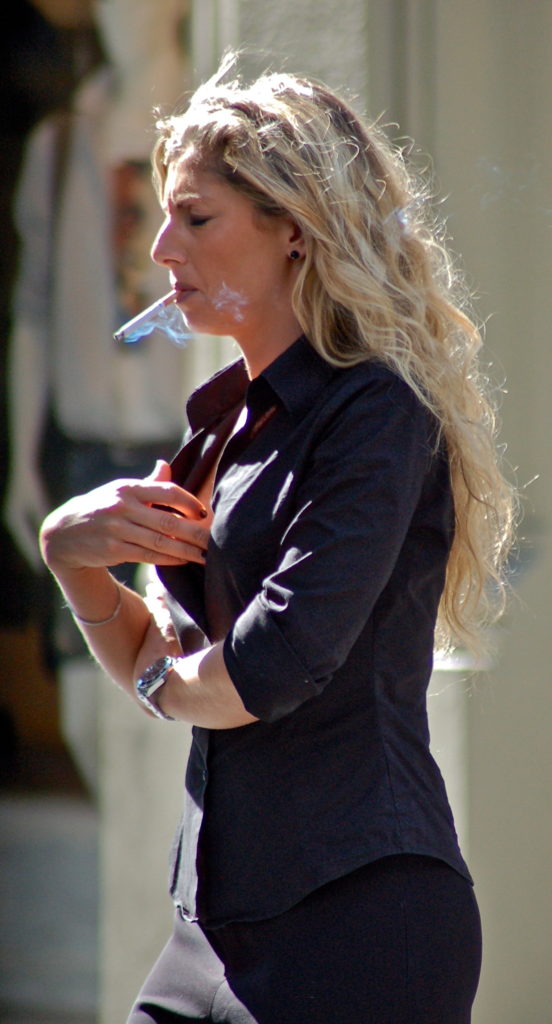 Candid girl on cigarette break